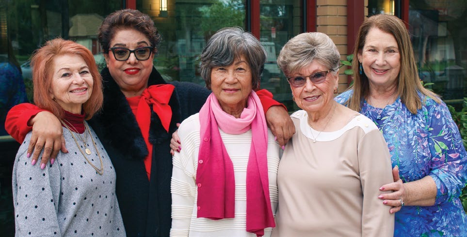 A group of women together, pictured in the report’s community services section