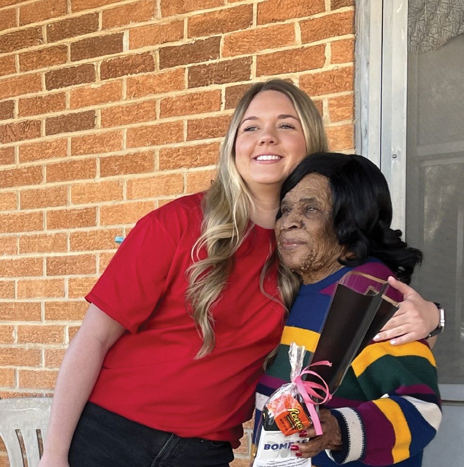 Two women together in a photograph from the report cover